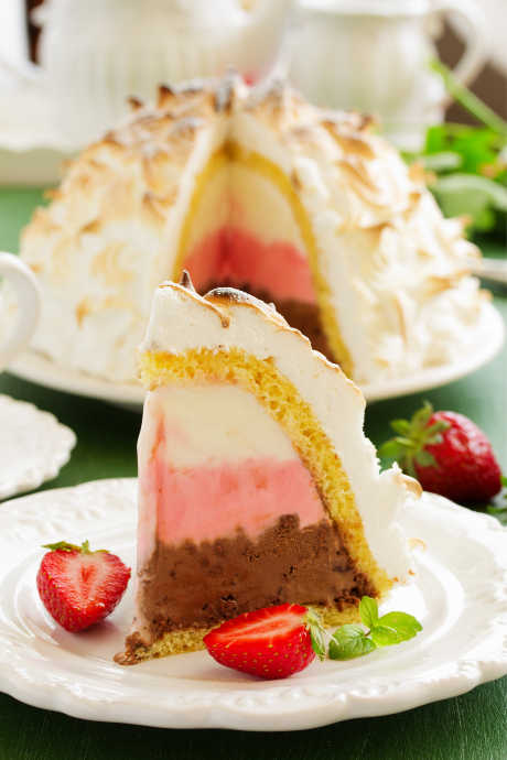 Baked Alaska: To help insulate the ice cream and prevent it from melting in the oven, wrap it in a layer of cake. This approach reduced the amount of meringue required to keep the ice cream cold, which also made the Baked Alaska not as cloyingly sweet.