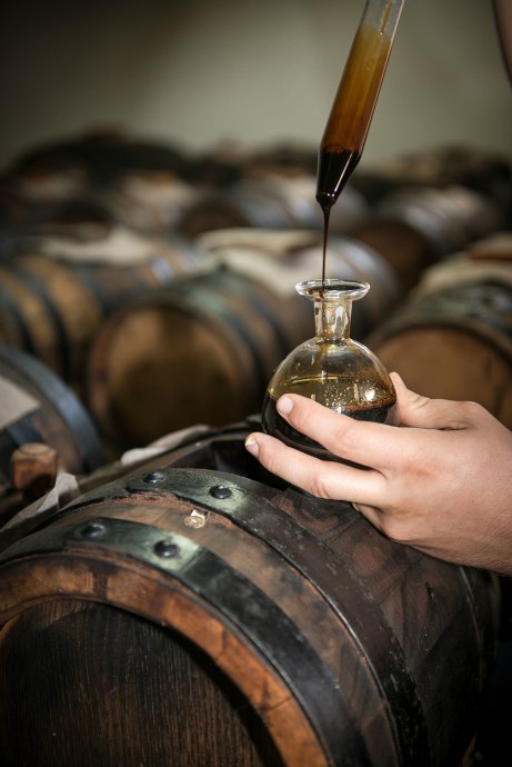 Balsamic vinegar comes from grape must -- grape juice, plus stems and seeds and skins. Grape must is cooked, reduced, and aged in barrels for 10 to 50 years or more.