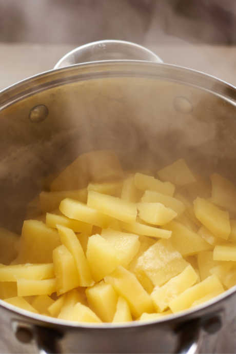 Potato Salad: How do you cook potatoes perfectly? Start by cutting them into evenly-sized pieces. Then put all of the pieces into a stockpot filled with cold water before turning on the burner.