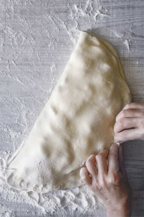 Homemade Calzones: Add more filling than you think the calzone can accommodate, so that you’ll need to stretch the dough over the top before sealing and crimping the seam with a fork.