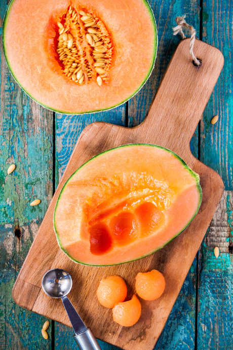 Carefully slice the cantaloupe and scoop out the seeds. Then use a melon baller to create uniform spheres of cantaloupe.