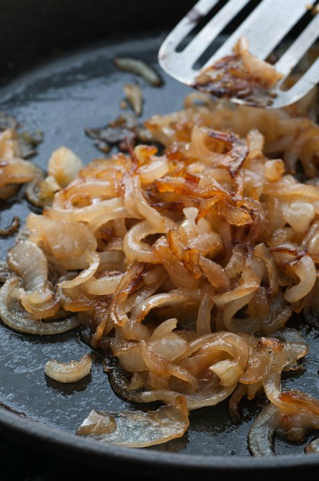 Caramelized onions require patience and attention. Cook caramelized onions over medium heat or lower. If you crank up the heat, you'll end up with sautéed or fried onions.