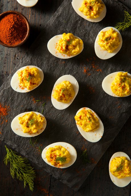 While "deviled" came to mean spicy in the culinary world, "stuffed" was often used to describe these eggs instead.