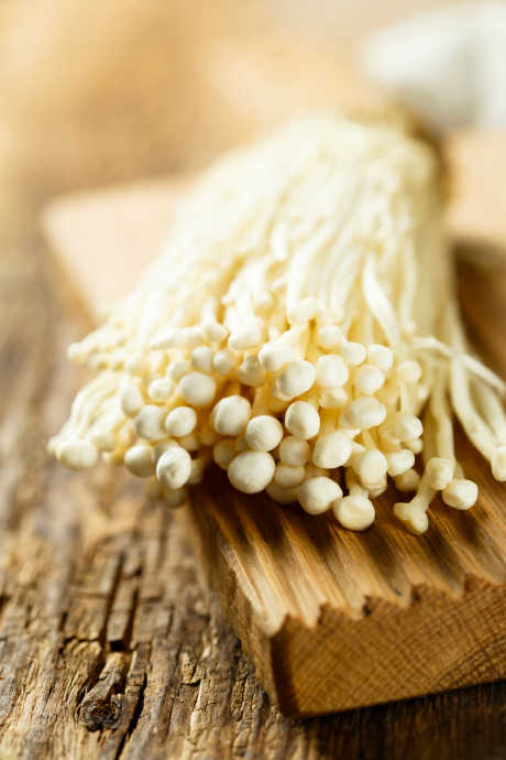 Mushroom Varieties: Enoki mushrooms are even lighter than white button mushrooms, with long slender stems and small round caps. They have a mild flavor and a crunchy texture, and are often served raw in salads and on sandwiches