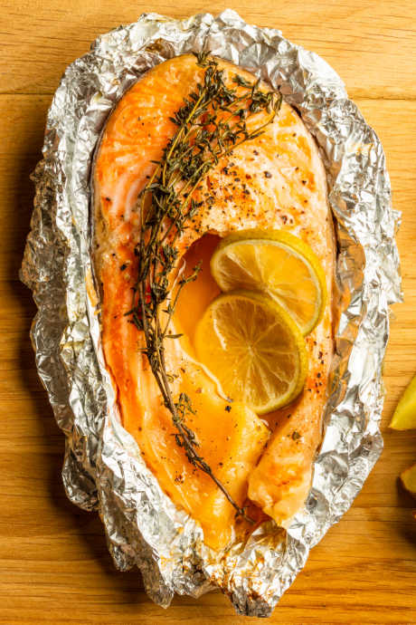 Aluminum foil is best used to protect food from extreme temperatures, like freezing and grilling. We love creating foil packets to grill all-in-one meals. We also use aluminum foil to prevent food from breaking when turning it on the grill, or falling through grill grates.