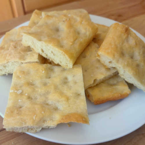Focaccia is a flat bread made with yeast and olive oil, and it hails from Liguria in Italy. Use it as sandwich bread, top it with sauce and vegetables, or dip it in hummus or a mixture of olive oil and balsamic vinegar.
