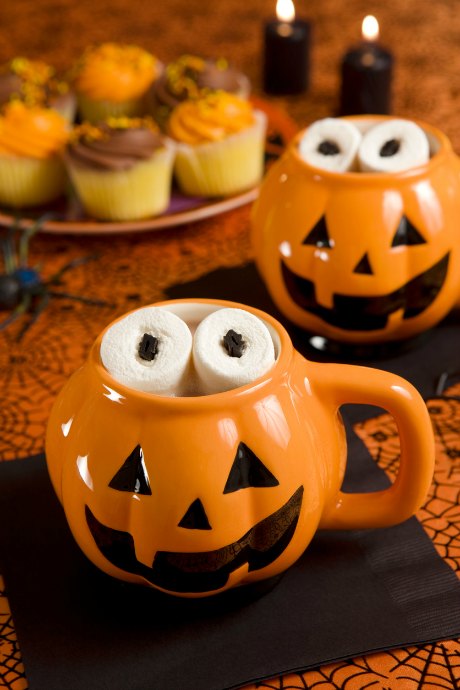 Warm up with cocoa on Halloween, and make it even spookier by turning marshmallows into eyes