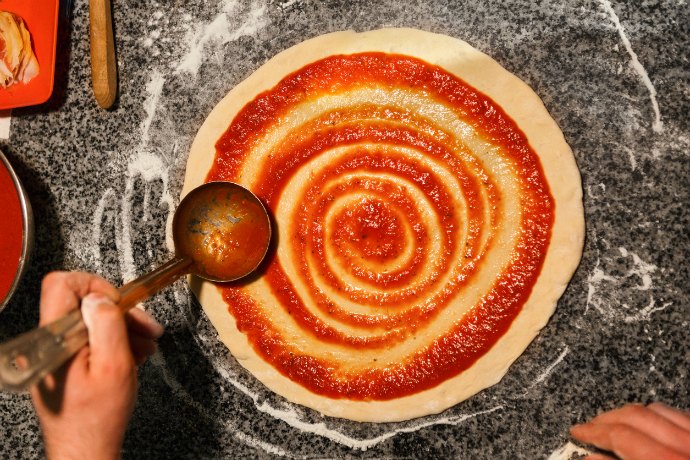 While homemade pizza dough involves a whole host of variables, sauce seems to boil down to one fundamental question: Cook it or not?