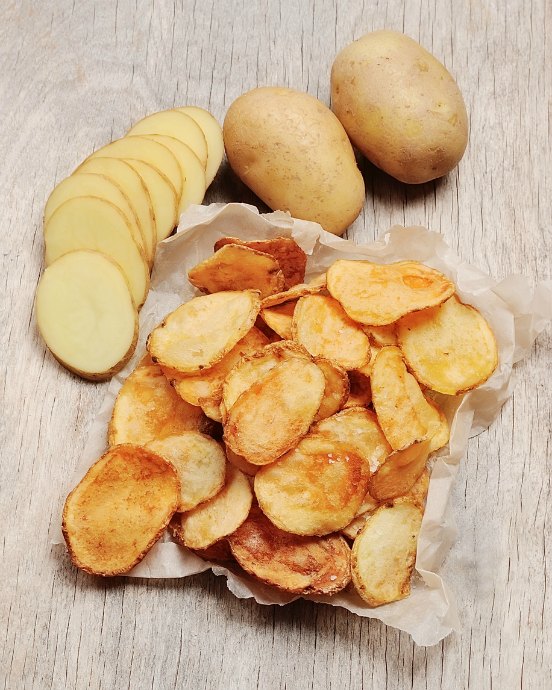 Try making homemade potato chips. With the right tools, they're easier than you might think -- and far more delicious than the bagged variety too.