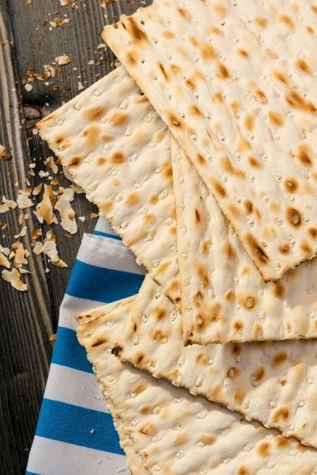 Matzo is unleavened bread that's similar to a cracker in thickness, taste, and texture. Think of matzo as an ingredient, rather than something to eat all on its own.