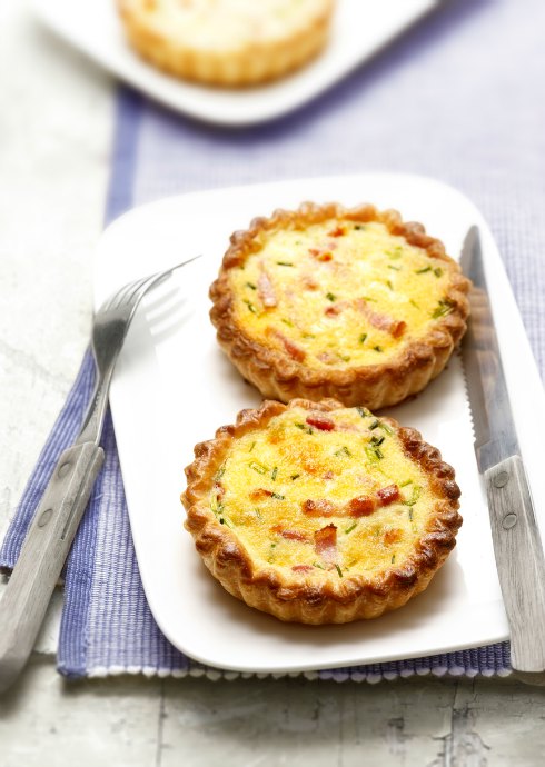 Breakfast in Bed: Whether you make them yourself or heat up a frozen variety, mini quiches are a fun, simple way to treat Mom. Eat them one-handed, or use a fork. The crust may crumble a bit, but quiche is generally tidy. You can even go with a crustless quiche recipe.