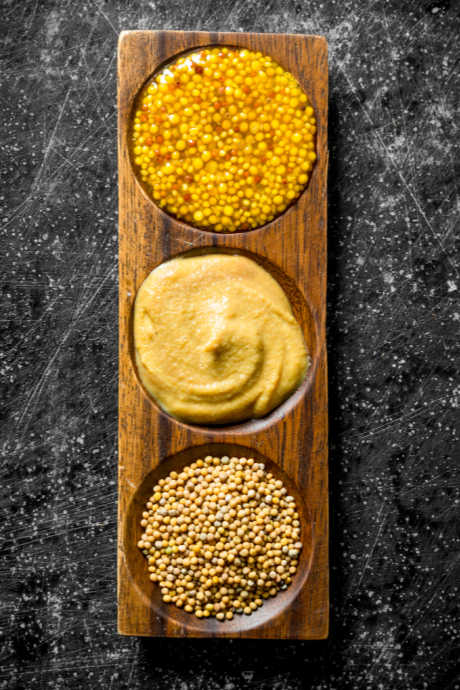 Mustard made with yellow seeds and vinegar is on the mild end of the spectrum, while mustard made with brown or black seeds and cold water will be on the hot and spicy side.