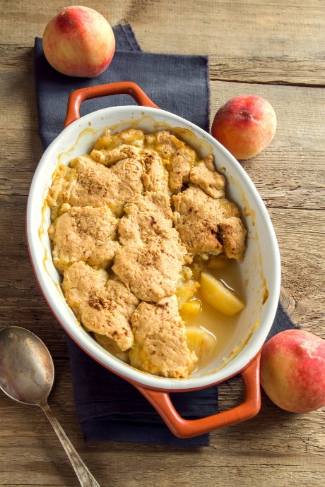A good cobbler recipe uses fresh fruit and homemade biscuit dough.