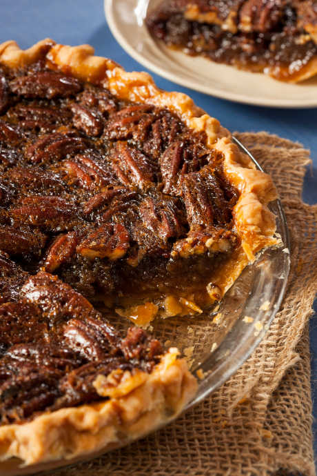 Using corn syrup in addition to sugar in pecan pie keeps the filling sticky and smooth without it being overly sweet.