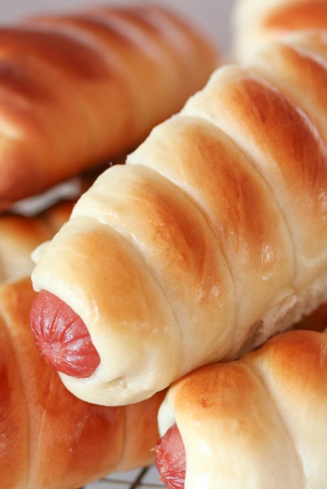 Wrap pretzel dough around hot dogs to create pretzel dogs, which are a kid favorite.