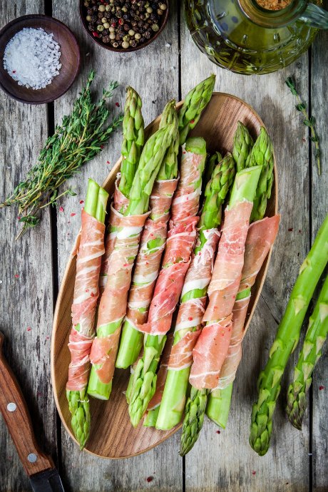 If you're planning a gathering this spring, we recommend whipping up a batch of prosciutto-wrapped asparagus as appetizers. Your guests will be impressed.