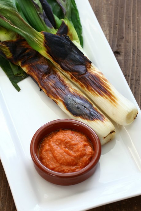 Romesco is a sauce made from nuts, red peppers, garlic, and oil. Originated in Tarragona, Catalonia.