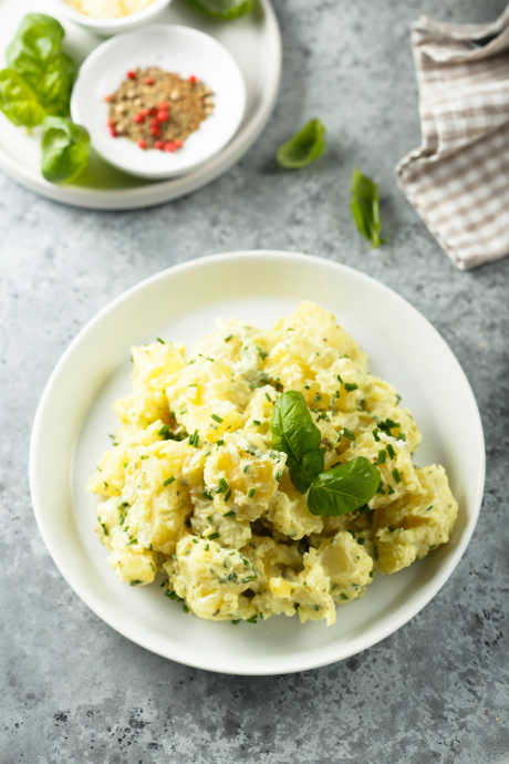 Potato Salad: Be sure to add plenty of salt to the cooking water, along with vinegar. Vinegar makes the pH of the cooking water more acidic, which prevents the pectin from breaking down as readily. In short, adding vinegar not only helps season your potatoes, it also helps you avoid overcooking them.