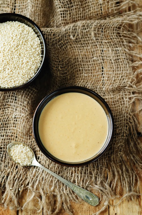 You can buy pre-made tahini, but it's also easy to make your own. Get sesame seeds from a bulk bin at a natural or Asian grocery, then toast them and blend them with some neutral oil.