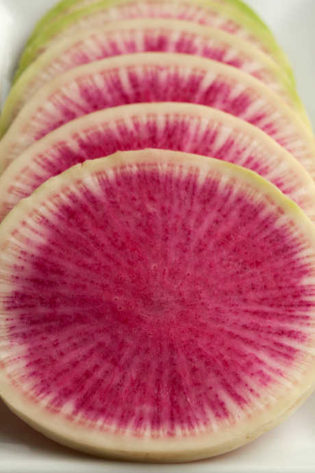 Watermelon radishes are a beautiful addition to salads, or they can be the main ingredient in a salad. As their name implies, this variety has a green exterior and bright pink flesh inside.
