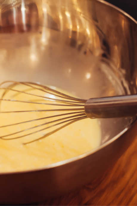 Yes, Please or We'll Pass - Eggnog: When tempering eggs, remember to slowly add the hot milk and spices to the egg yolks whisked with sugar. If you combine everything all at once, the temperature will rise too quickly and the eggs will scramble.